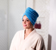 Photo of a women wearing a 100% Cotton Turbie Twist in the color Blue.