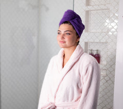 Picture of women wearing a 100% Cotton Turbie Twist in the color Purple.