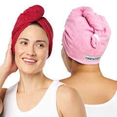 Photo of two women wearing Microfiber Turbie Twists with one on the left wearing the color Red and the other on the right wearing the color Pink.