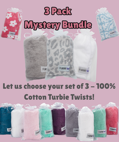 100% Cotton Turbie Twist hair towels in assorted colors and prints packaged in organza bags to demonstrate possible color and pattern assortments in the Mastery 3 Pack.