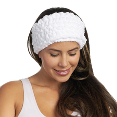 A woman smiling, wearing a white Turbie band.