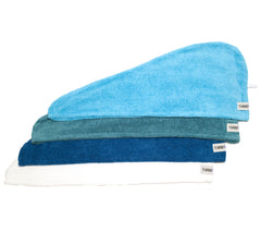 4 Pack of 100% Cotton Turbie Twists in the colors Light Blue, Teal, Dark Blue, and White.