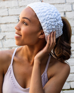 woman wearing a white turbie band wide headband