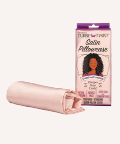 Pink satin pillowcase, rolled, next to pillowcase in packaging